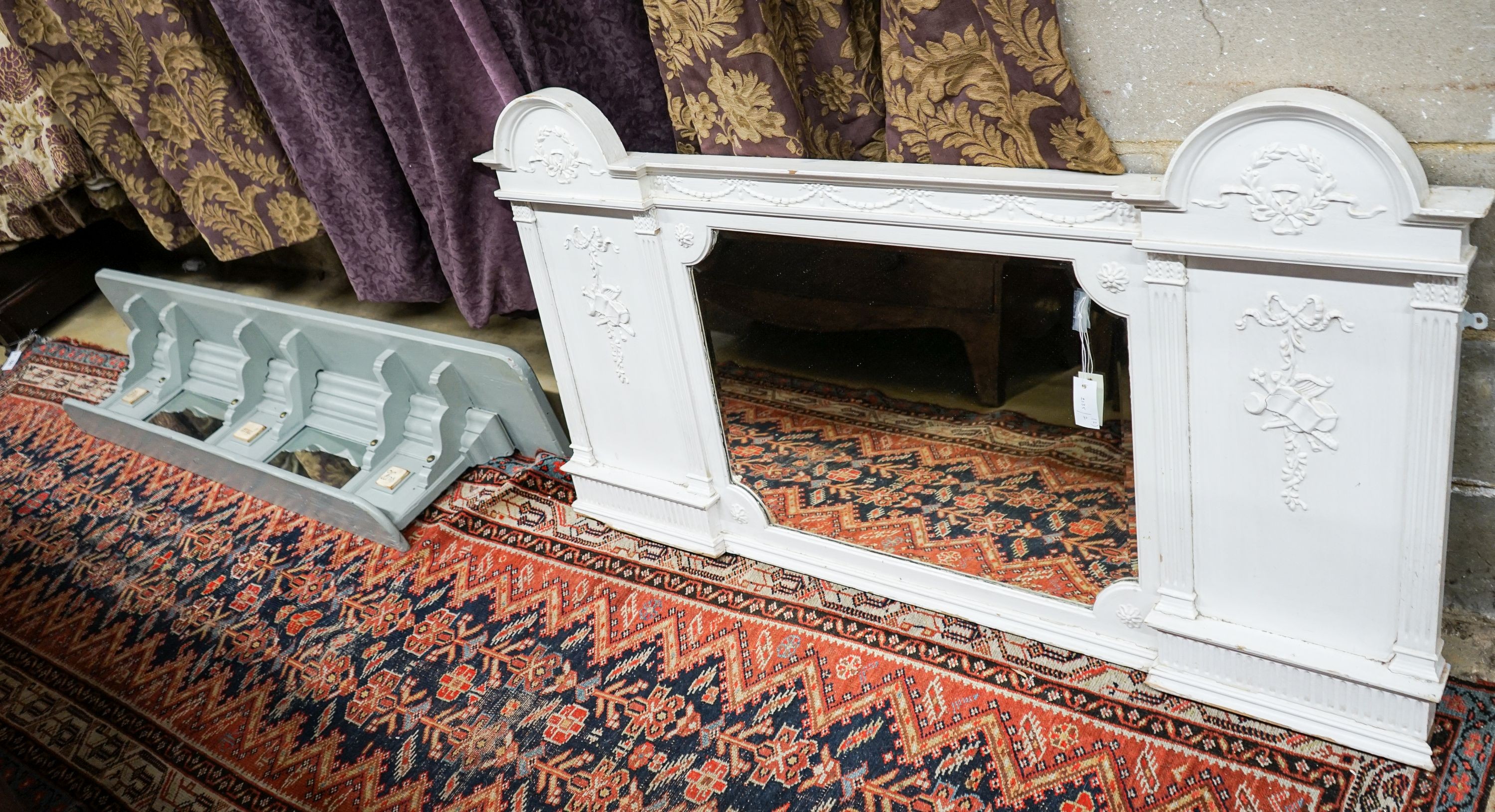 A Victorian later painted overmantel mirror, width 143cm, height 76cm together with a painted and mirrored overmantel